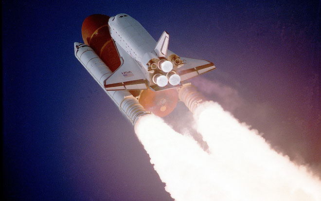 Shuttle lifting off in the sky