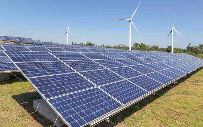 Blue skies, wind turbines and solar panels