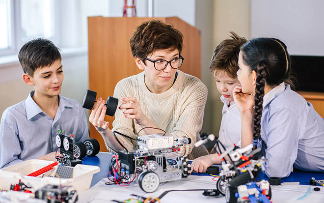 Kids learning robotics from one of are experts